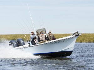 A blue and white boat owned by the Wounded Warriors in Action Foundation.