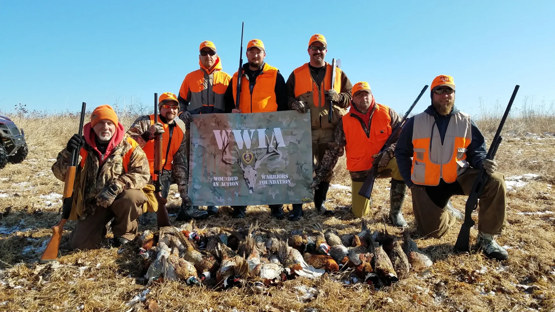 Group with WWIA banner and many pheasants Wounded Warriors in Action Foundation Group with WWIA banner and many pheasants