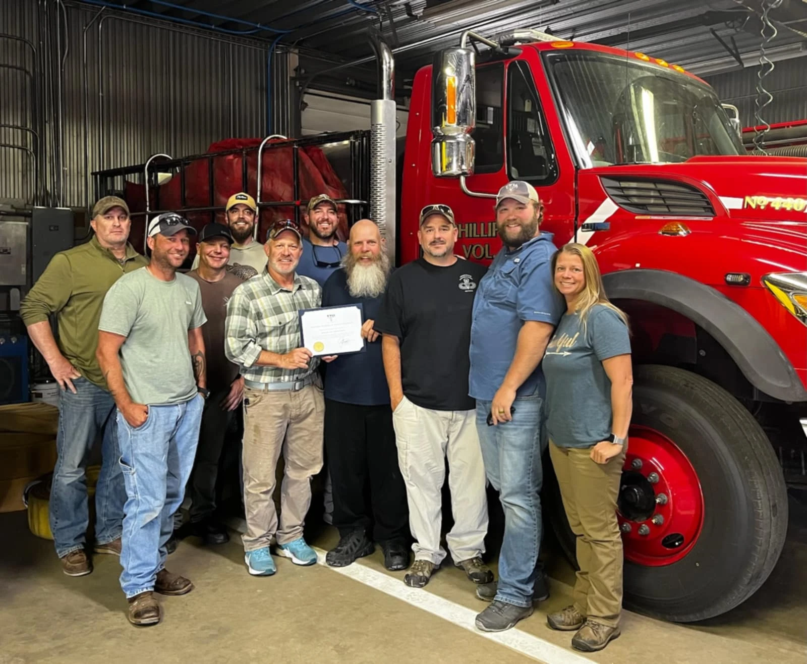 Group of people beside a fire truck