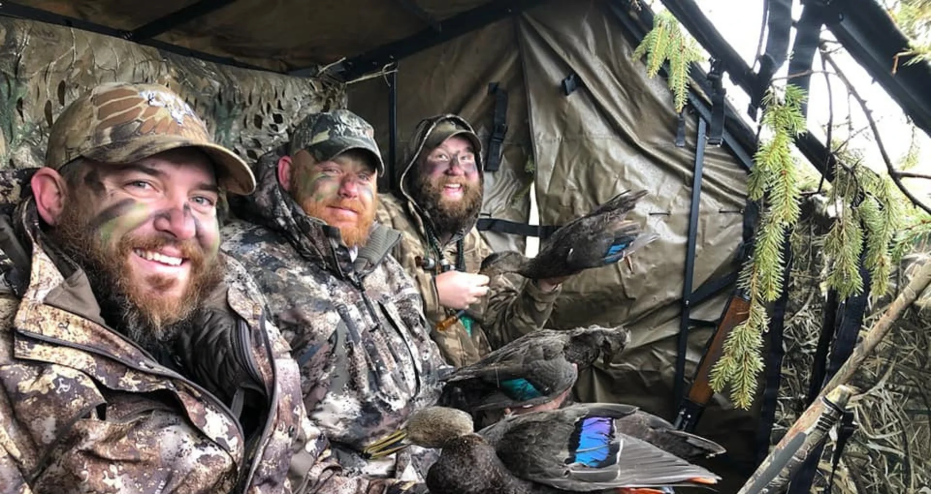 Hunters in camo with ducks in blind Wounded Warriors in Action Foundation Hunters in camo with ducks in blind