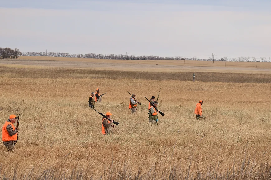 Hunters in field wearing orange safety gear Wounded Warriors in Action Foundation Hunters in field wearing orange safety gear