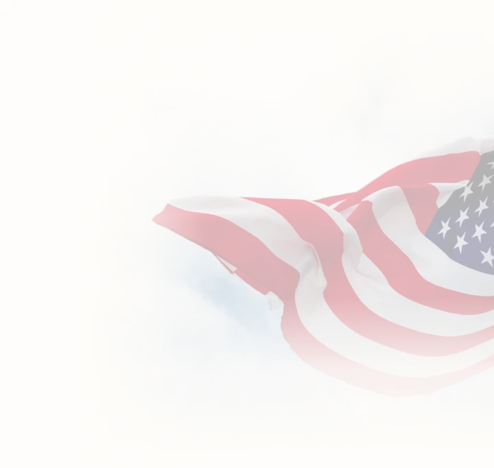Waving American flag against cloudy sky