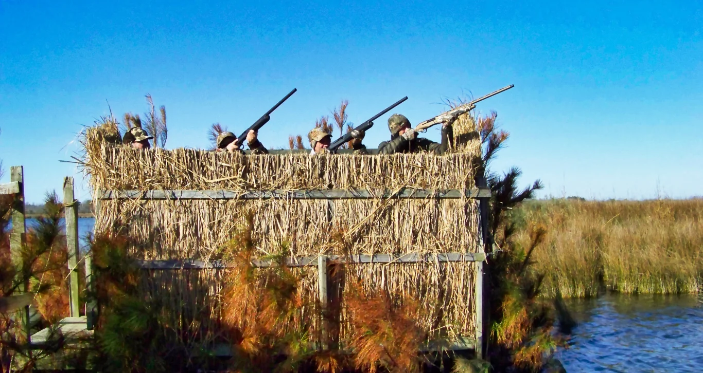 Hunters in camouflage at a duck blind Wounded Warriors in Action Foundation Hunters in camouflage at a duck blind