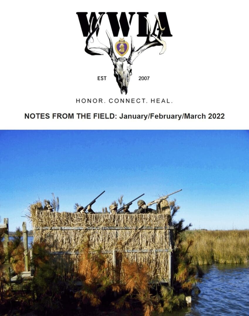 Hunters in camouflage blind near water