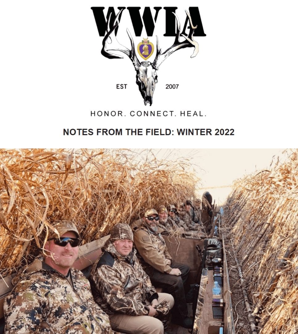 Hunters in camouflage sitting in a blind
