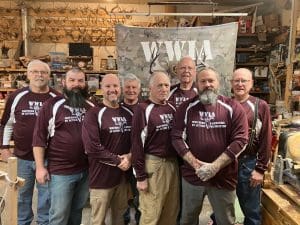 Group of men in matching maroon shirts