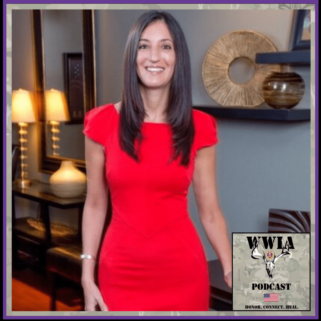 Woman in red dress smiling indoors