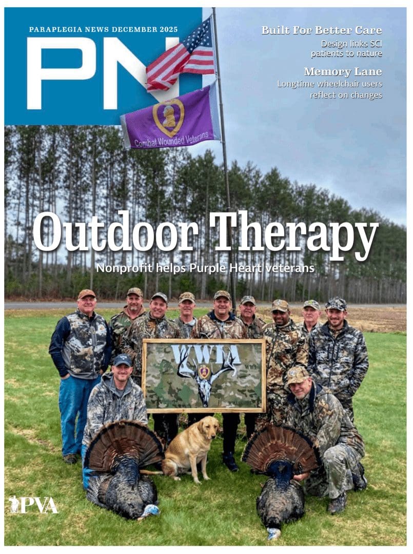 Group of veterans outdoors with therapy dog