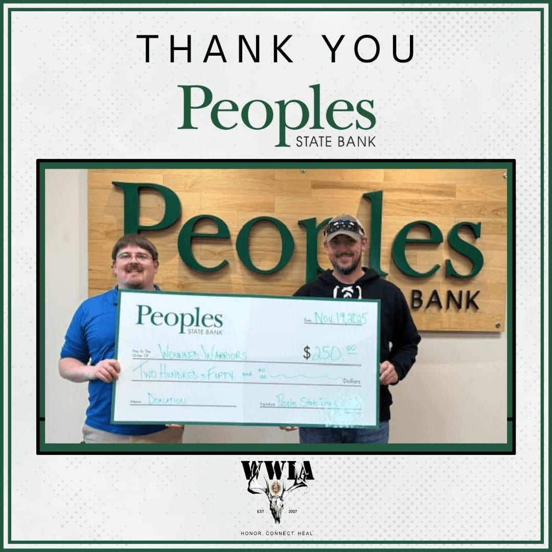 Two men holding a large check