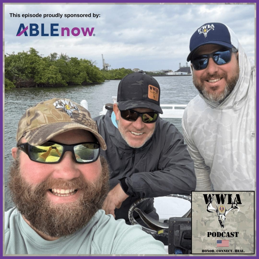 Three men smiling on a boat